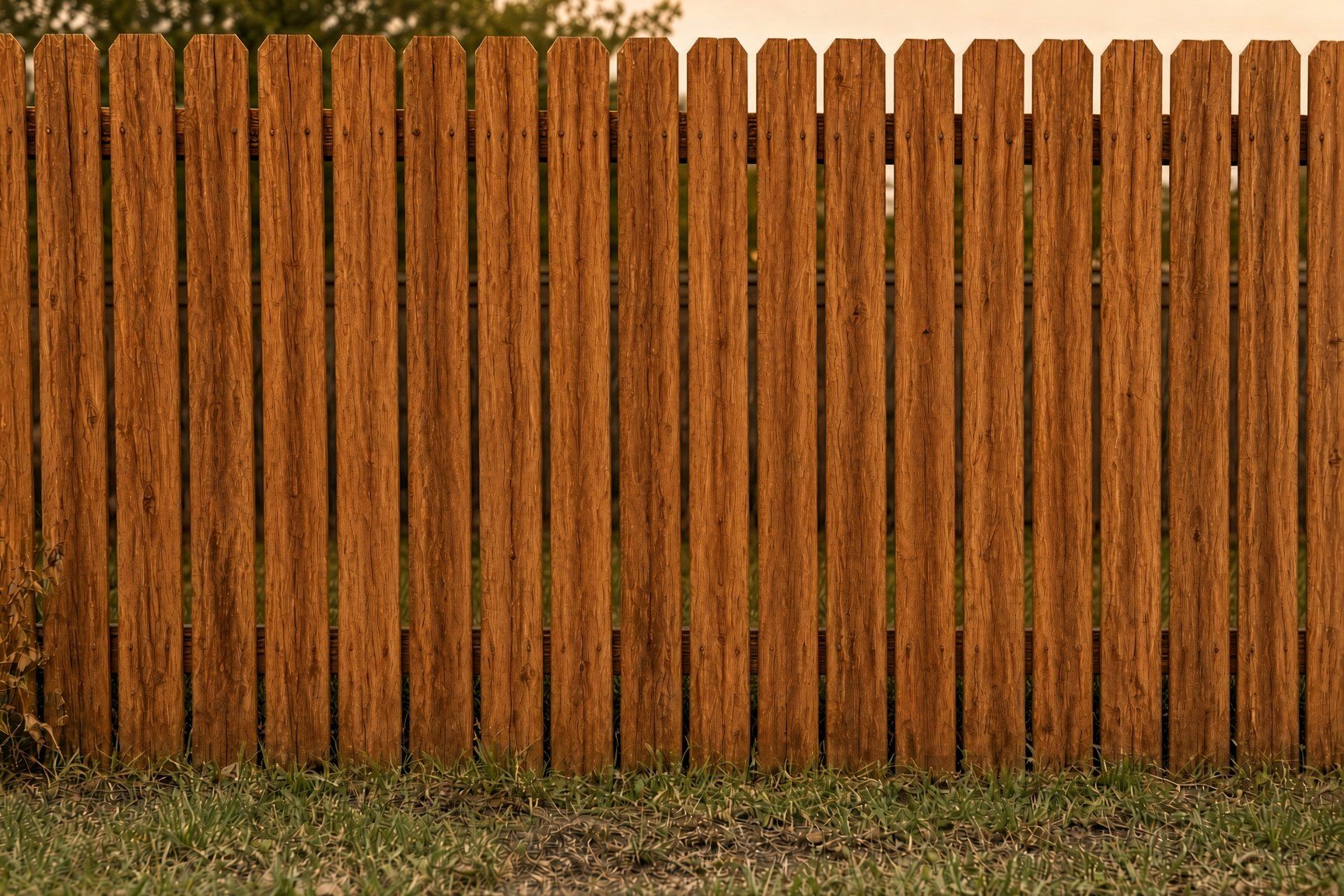 The same fence after cedar stain revival